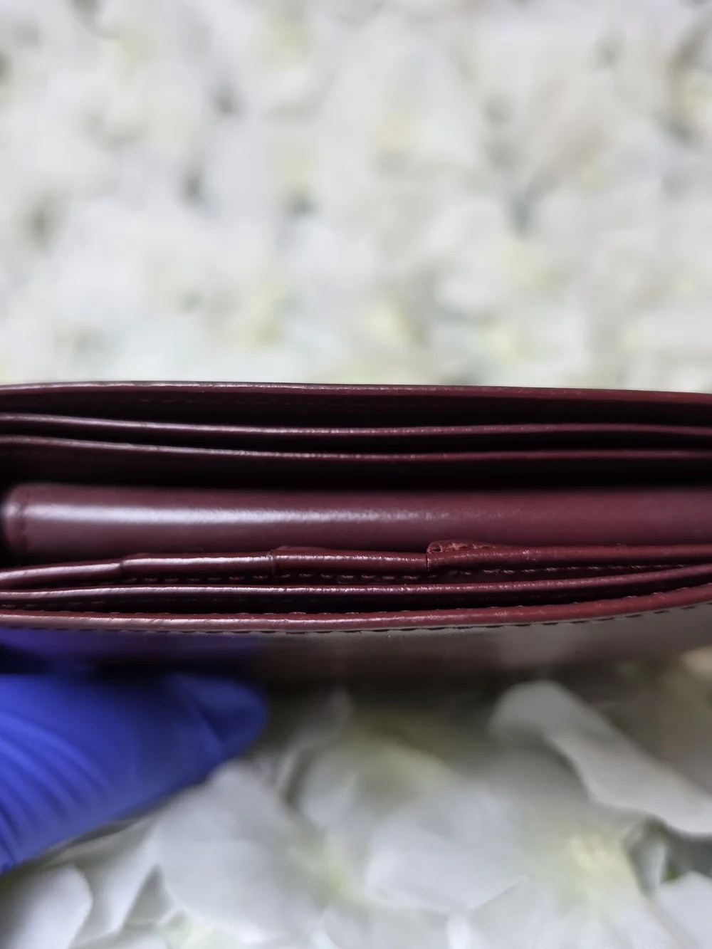 Burgundy Cartier Wallet with Embossed Logo and Gold Corners